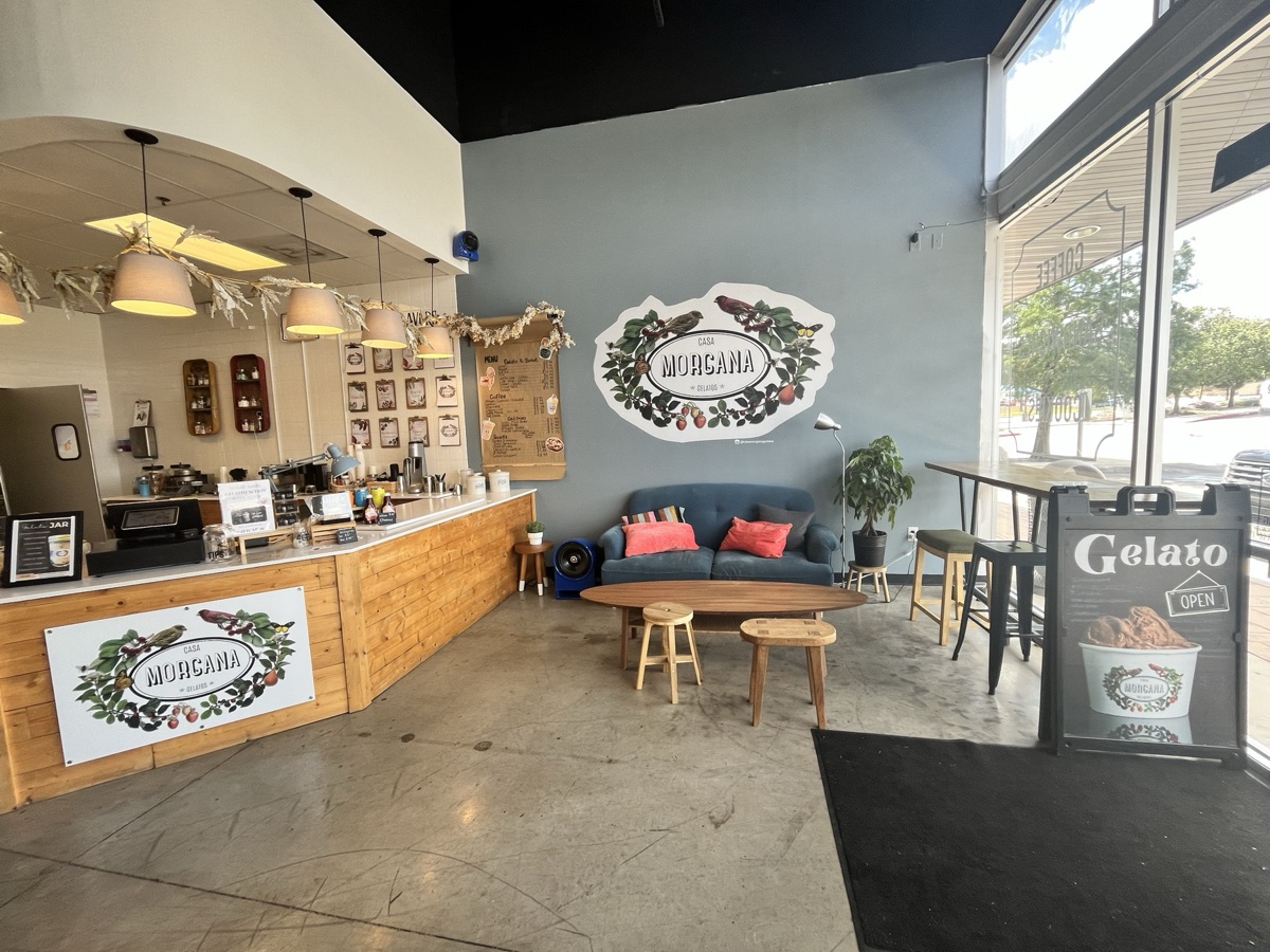 Warm interior of a cozy gelato shop with seating