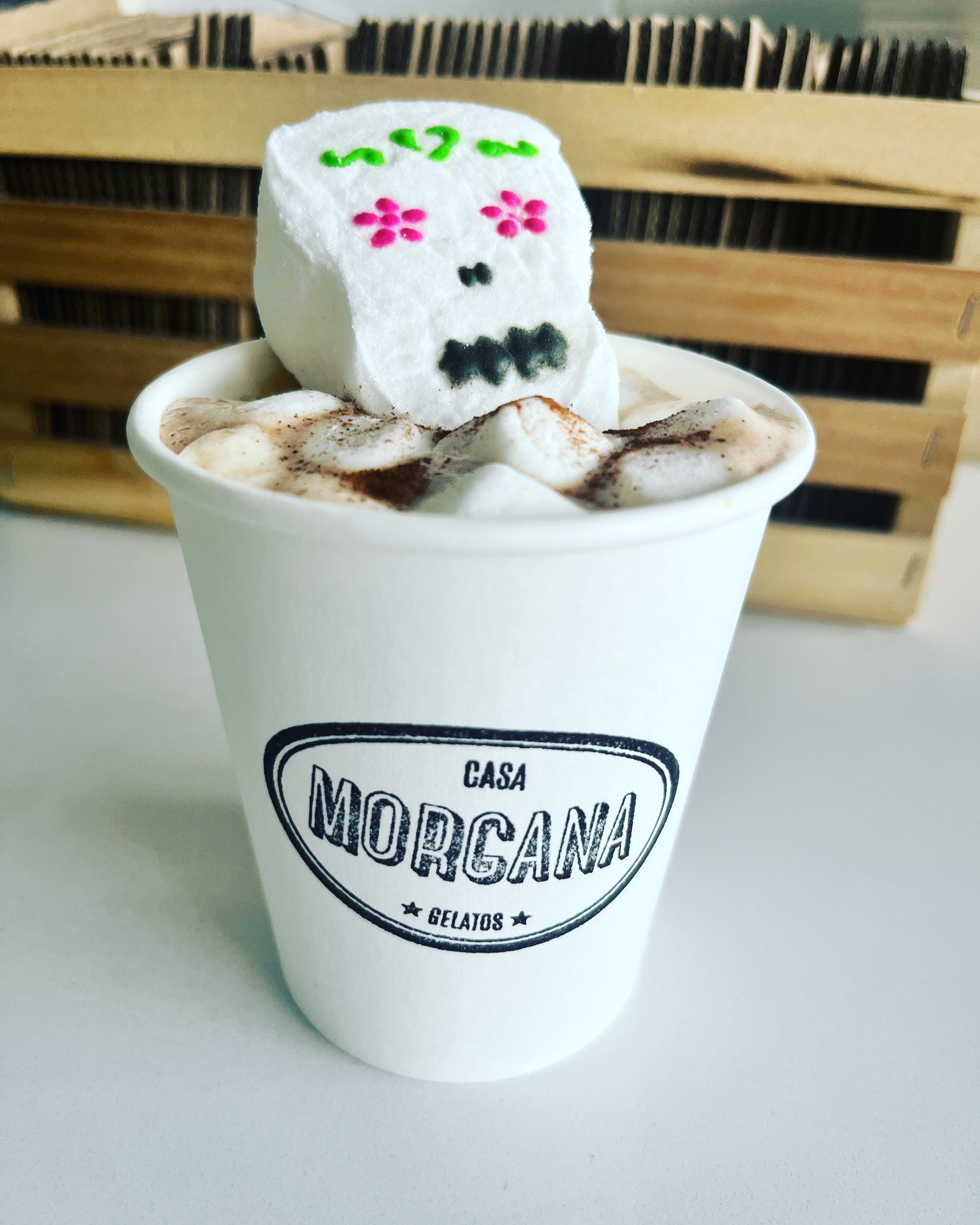Casa Morgana branded gelato cup with a Día de los Muertos sugar skull topper